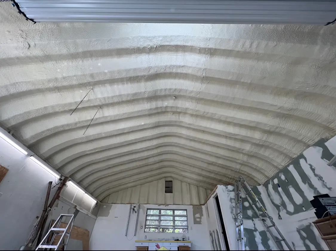 Spray polyurethane foam applied to the underside of a metal roof deck in Sandy Springs